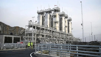 Large carbon capture facility with storage tanks and industrial piping