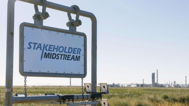 Stakeholder Midstream sign near energy infrastructure in the Permian Basin