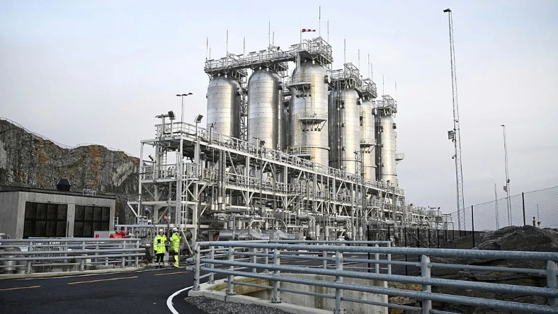 Large carbon capture facility with storage tanks and industrial piping