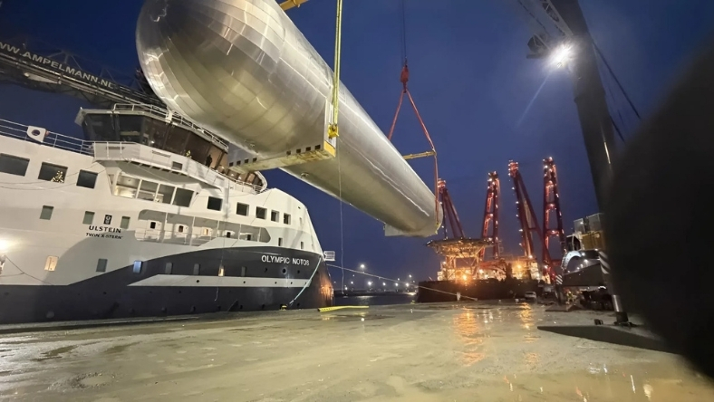 Heavy-lift vessel installs offshore CO₂ storage component at port, reflecting Denmark’s first approved offshore carbon storage site